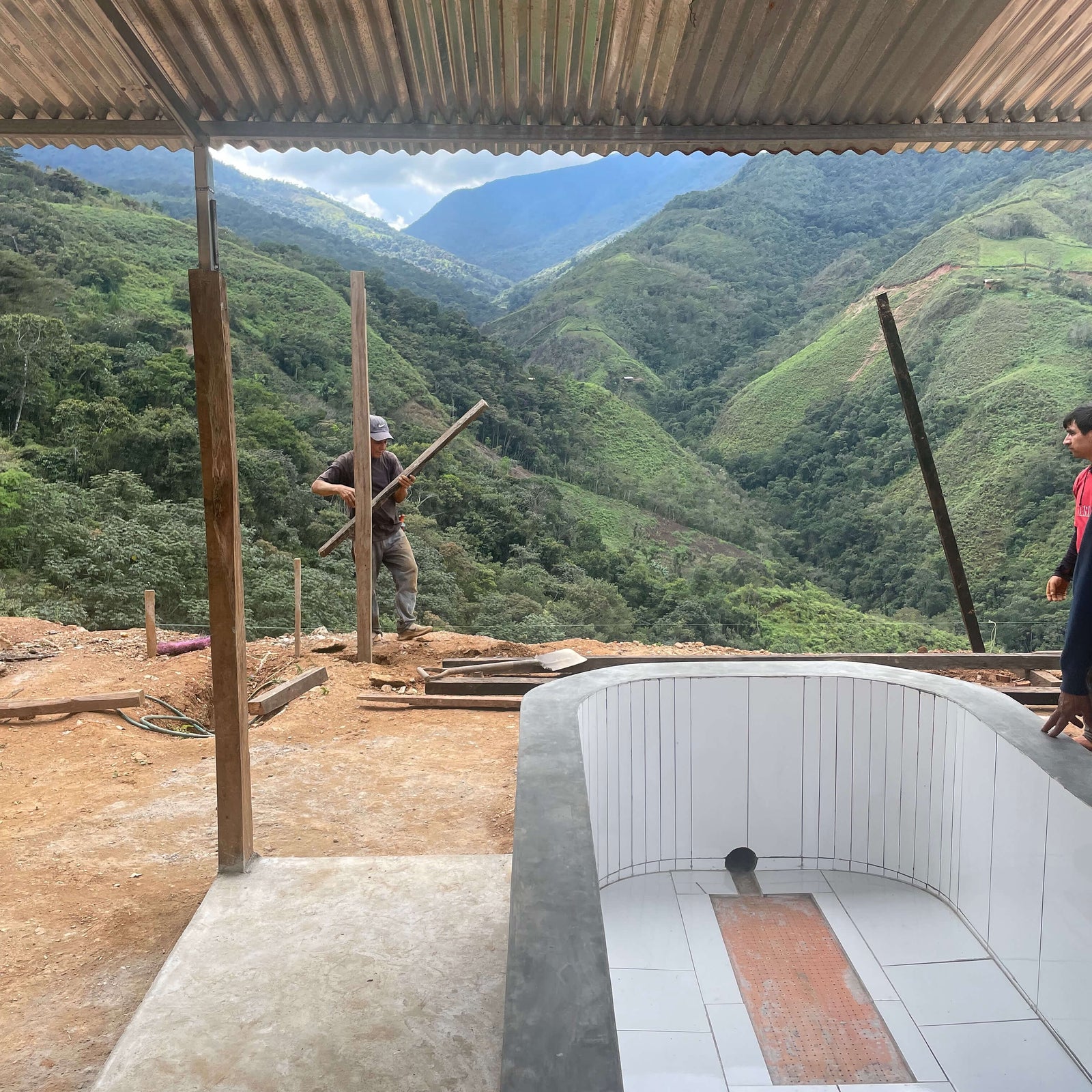 Construction site of new processing rank with mountains in the background