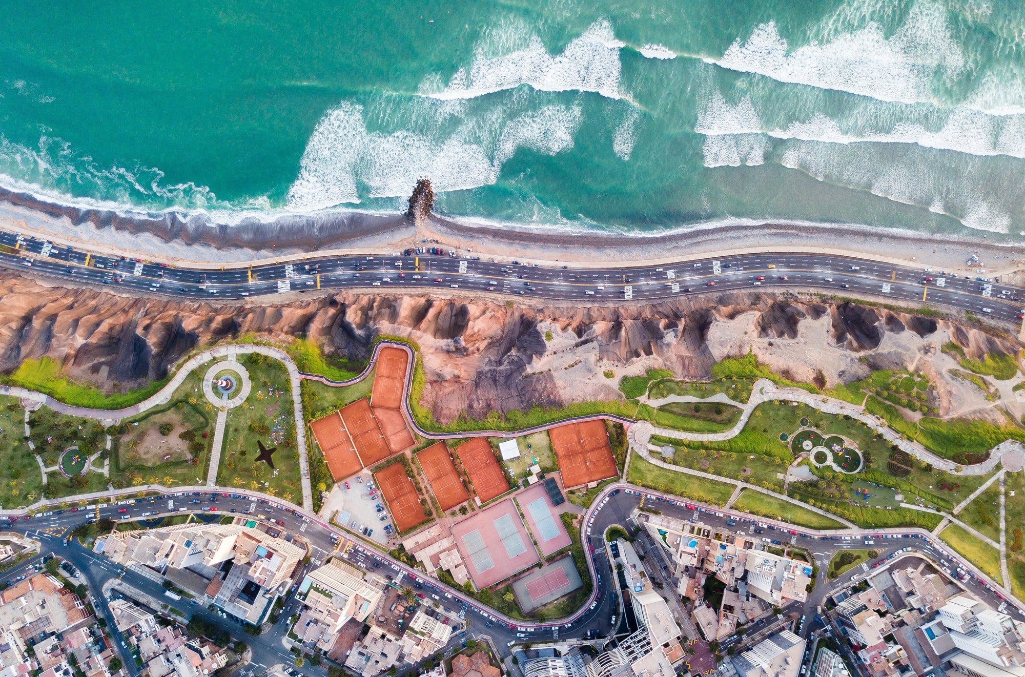 this shows lima from above and the costa verde coastline 